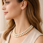 Caída del collar doble de perla crema equilibrado