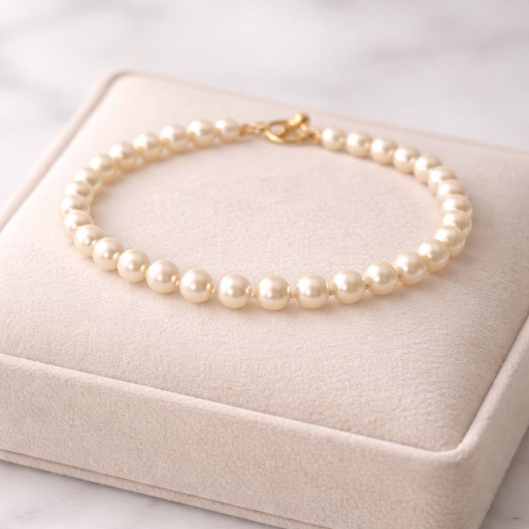 Pulsera de perla crema 6 mm en exhibidor
