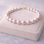 Pulsera de perla rosa pastel 8 mm en exhibidor